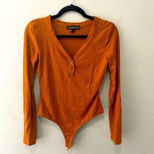 Orange long sleeve bodysuit